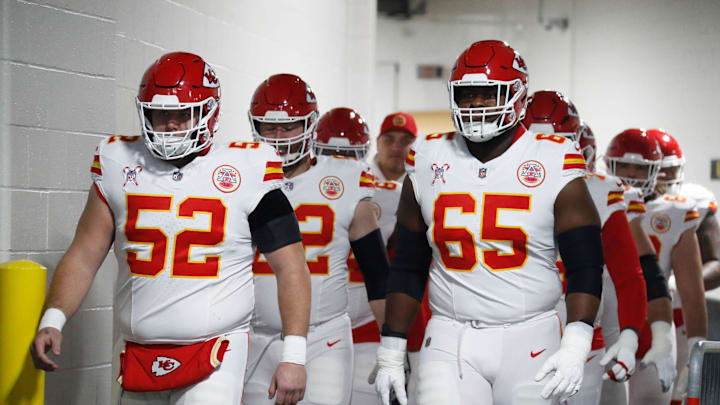 Dec 25, 2024; Pittsburgh, Pennsylvania, USA;  Kansas City Chiefs center Creed Humphrey (52) and guard Trey Smith (65) walk to the field to warm up against the Pittsburgh Steelers at Acrisure Stadium. Mandatory Credit: Charles LeClaire-Imagn Images