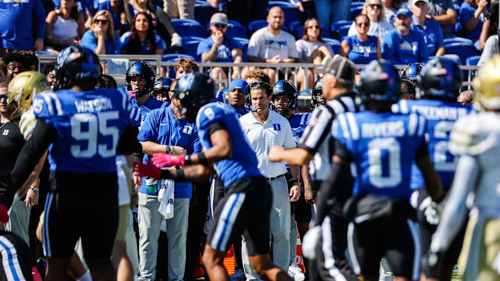 Oct 18, 2025; Durham, North Carolina, USA; Duke Blue Devils head coach Manny Diaz looks on during the first half of the game against Georgia Tech Yellow Jackets at Wallace Wade Stadium. Mandatory Credit: Jaylynn Nash-Imagn Images Oct 18, 2025; Durham, North Carolina, USA; Duke Blue Devils head coach Manny Diaz looks on during the first half of the game against Georgia Tech Yellow Jackets at Wallace Wade Stadium. Mandatory Credit: Jaylynn Nash-Imagn Images