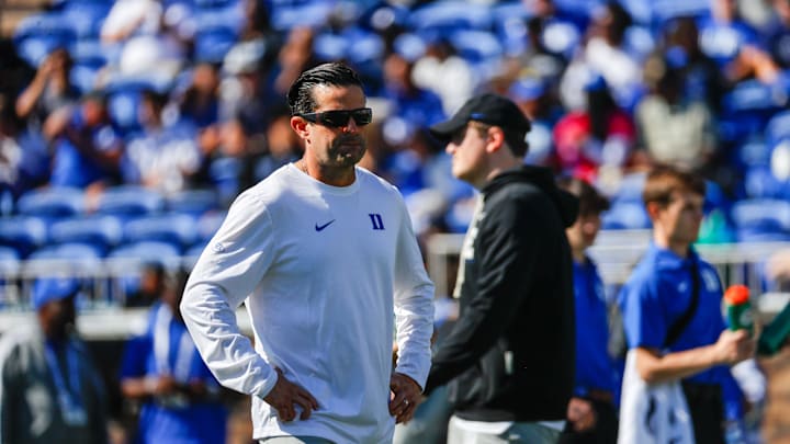 Oct 18, 2025; Durham, North Carolina, USA;  Duke Blue Devils head coach Manny Diaz looks on during the warmups of the game against Georgia Tech Yellow Jackets at Wallace Wade Stadium. Mandatory Credit: Jaylynn Nash-Imagn Images