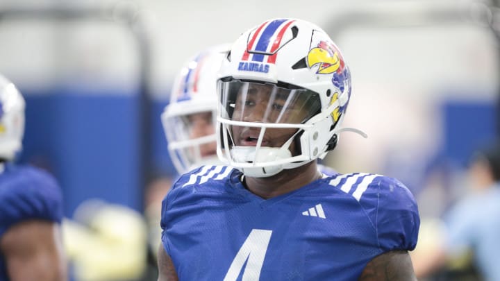 Kansas senior running back Devin Neal (4) practices with the team on Tuesday, April 2, 2024, inside the Indoor Football Practice Facility.