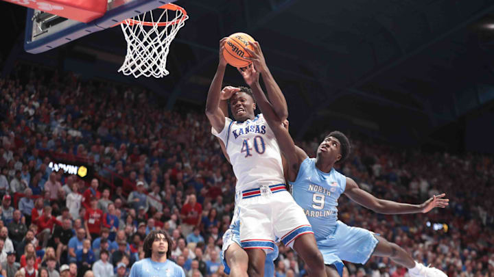 Kansas Jayhawks forward Flory Bidunga (40) fights for a rebound against North Carolina Tar Heels guard Drake Powell (9) in the first half of the game inside Allen Fieldhouse Friday, Nov. 8, 2024. Kansas Jayhawks forward Flory Bidunga (40) fights for a rebound against North Carolina Tar Heels guard Drake Powell (9) in the first half of the game inside Allen Fieldhouse Friday, Nov. 8, 2024.