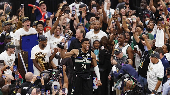 Jul 20, 2021; Milwaukee, Wisconsin, USA; Milwaukee Bucks forward Giannis Antetokounmpo (34) celebrates with the NBA Finals MVP Trophy following the game against the Phoenix Suns following game six of the 2021 NBA Finals at Fiserv Forum. Mandatory Credit: Jeff Hanisch-Imagn Images Jul 20, 2021; Milwaukee, Wisconsin, USA; Milwaukee Bucks forward Giannis Antetokounmpo (34) celebrates with the NBA Finals MVP Trophy following the game against the Phoenix Suns following game six of the 2021 NBA Finals at Fiserv Forum. Mandatory Credit: Jeff Hanisch-Imagn Images