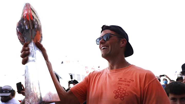 Tampa Bay Buccaneers quarterback Tom Brady holds the Vince Lombardi Trophy.