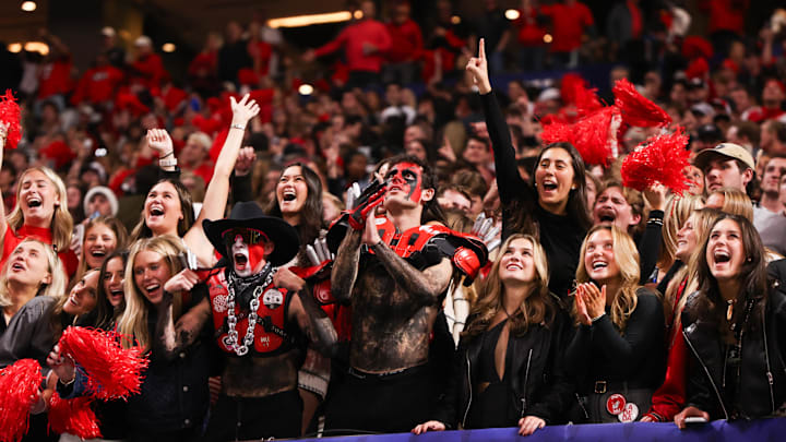 Georgia Bulldogs fans cheer during the fourth quarter against the Alabama Crimson Tide. Georgia Bulldogs fans cheer during the fourth quarter against the Alabama Crimson Tide.