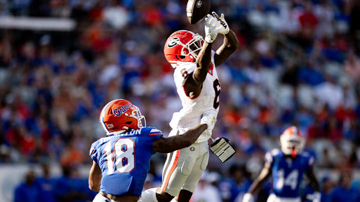 Florida Gators safety Bryce Thornton (18) breaks up a pass to Georgia Bulldogs wide receiver Dominic Lovett (6) during the first half at Everbank Stadium in Jacksonville, FL on Saturday, October 28, 2023. [Matt Pendleton/Gainesville Sun]