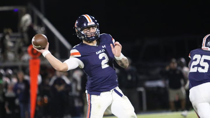 Nashville Christian quarterback Jared Curtis (2) drops his arm angle down to make a pass around Fayetteville defenders during the first quarter of their TSSAA football game Friday, Oct. 18, 2024 at Nashville Christian School in Nashville, Tennessee.