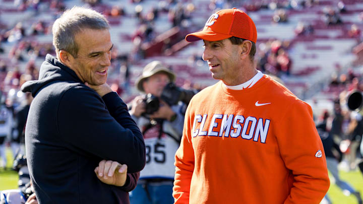 Nov 29, 2025; Columbia, South Carolina, USA;
Clemson Tigers head coach Dabo Swinney and South Carolina Gamecocks head coach Shane Beamer chat before their game at Williams-Brice Stadium. Mandatory Credit: Jeff Blake-Imagn Images Nov 29, 2025; Columbia, South Carolina, USA;
Clemson Tigers head coach Dabo Swinney and South Carolina Gamecocks head coach Shane Beamer chat before their game at Williams-Brice Stadium. Mandatory Credit: Jeff Blake-Imagn Images