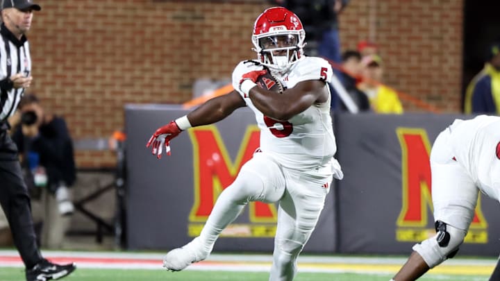 Nov 16, 2024; College Park, Maryland, USA; Rutgers Scarlet Knights running back Kyle Monangai (5) runs for a gain during the first half against the Maryland Terrapins at SECU Stadium.  