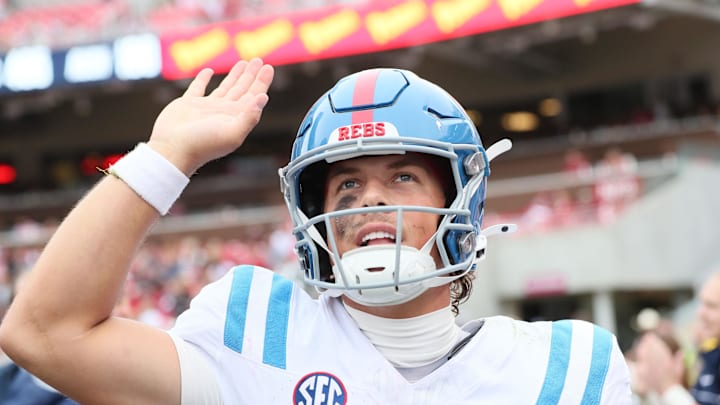 Nov 2, 2024; Fayetteville, Arkansas, USA; Ole Miss Rebels quarterback Jaxson Dart (2) celebrates after a touchdown in the third quarter against the Arkansas Razorbacks at Donald W. Reynolds Razorback Stadium. Mississippi won 63-31.  