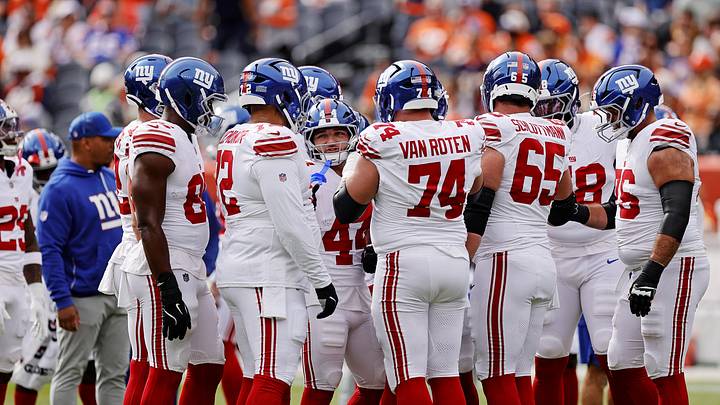 The New York Giants huddle up before the game against the Denver Broncos at Empower Field at Mile High. 