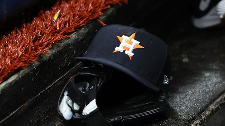 Mar 28, 2019; St. Petersburg, FL, USA; A detail view of a Houston Astros baseball hat and glove lay in the dugout at Tropicana Field. Mandatory Credit: Kim Klement-Imagn Images