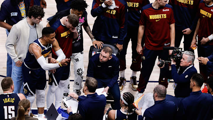 Apr 21, 2025; Denver, Colorado, USA; Denver Nuggets guard Russell Westbrook (4) talks as interim head coach David Adelman looks on in the fourth quarter against the Los Angeles Clippers during game two of first round for the 2025 NBA Playoffs at Ball Arena. Mandatory Credit: Isaiah J. Downing-Imagn Images Apr 21, 2025; Denver, Colorado, USA; Denver Nuggets guard Russell Westbrook (4) talks as interim head coach David Adelman looks on in the fourth quarter against the Los Angeles Clippers during game two of first round for the 2025 NBA Playoffs at Ball Arena. Mandatory Credit: Isaiah J. Downing-Imagn Images
