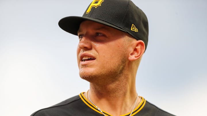 Jul 7, 2022; Cincinnati, Ohio, USA; Pittsburgh Pirates second baseman Josh VanMeter (26) walks off the field at the end of the second inning in the game against the Cincinnati Reds at Great American Ball Park. Mandatory Credit: Katie Stratman-Imagn Images