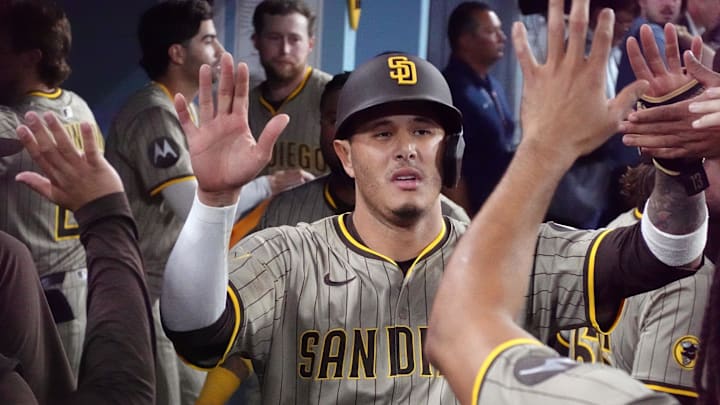 Jun 18, 2025; Los Angeles, California, USA; San Diego Padres third baseman Manny Machado (13) celebrates with teammates after scoring in the ninth inning against the Los Angeles Dodgers at Dodger Stadium. Mandatory Credit: Kirby Lee-Imagn Images Jun 18, 2025; Los Angeles, California, USA; San Diego Padres third baseman Manny Machado (13) celebrates with teammates after scoring in the ninth inning against the Los Angeles Dodgers at Dodger Stadium. Mandatory Credit: Kirby Lee-Imagn Images