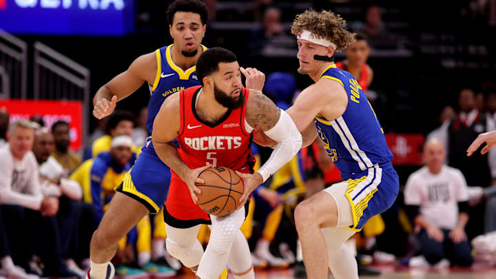 Nov 2, 2024; Houston, Texas, USA; Houston Rockets guard Fred VanVleet (5) handles the ball against Golden State Warriors guard Brandin Podziemski (2) during the first quarter at Toyota Center. Mandatory Credit: Erik Williams-Imagn Images
