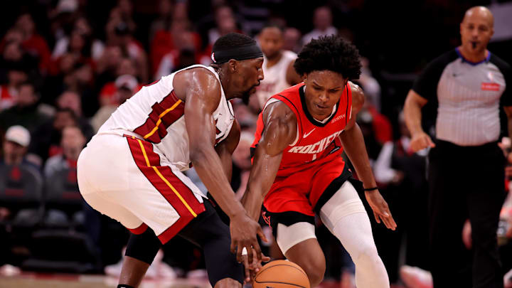 Dec 29, 2024; Houston, Texas, USA; Miami Heat guard Dru Smith (12) and Houston Rockets guard Amen Thompson (1) pursue a loose ball during the second quarter at Toyota Center. Mandatory Credit: Erik Williams-Imagn Images
Dec 29, 2024; Houston, Texas, USA; Miami Heat guard Dru Smith (12) and Houston Rockets guard Amen Thompson (1) pursue a loose ball during the second quarter at Toyota Center. Mandatory Credit: Erik Williams-Imagn Images