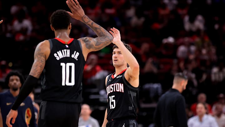 Mar 13, 2026; Houston, Texas, USA; Houston Rockets guard Reed Sheppard (15) is congratulated by Houston Rockets forward Jabari Smith Jr. (10) after a made basket against the New Orleans Pelicans during the second quarter at Toyota Center. Mandatory Credit: Erik Williams-Imagn Images