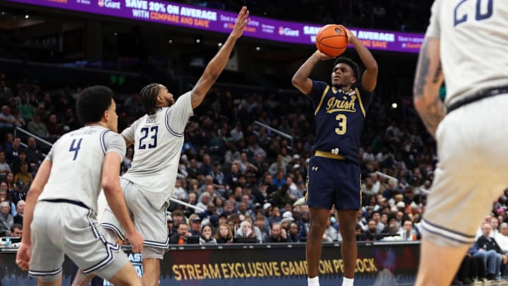 Nov 16, 2024; Washington, District of Columbia, USA; Notre Dame Fighting Irish guard Markus Burton (3) takes a shot over Georgetown Hoyas forward Jordan Burks (23) during the second half at Capital One Arena. Nov 16, 2024; Washington, District of Columbia, USA; Notre Dame Fighting Irish guard Markus Burton (3) takes a shot over Georgetown Hoyas forward Jordan Burks (23) during the second half at Capital One Arena.