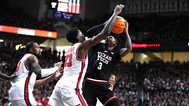 Feb 24, 2025; Lubbock, Texas, USA;  Texas Tech Red Raiders guard Elijah Hawkins (3) shoots against Houston Cougars guard Terrance Arceneaux (23) in the second half at United Supermarkets Arena. Mandatory Credit: Michael C. Johnson-Imagn Images
