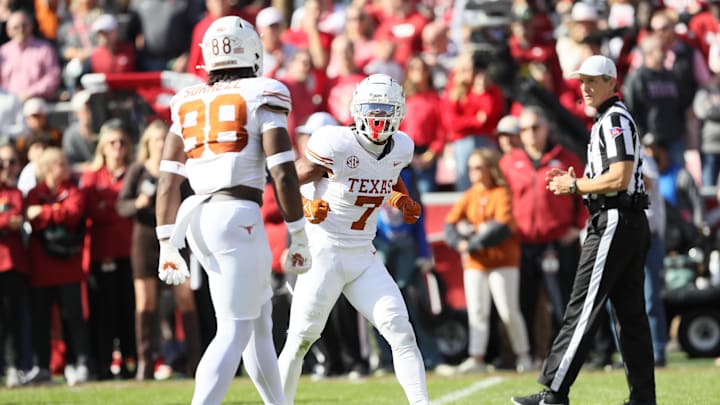 Nov 16, 2024; Fayetteville, Arkansas, USA; Texas Longhorns defensive back Jahdae Barron (7) celebrates after making a play against the Arkansas Razorbacks during the first quarter at Donald W. Reynolds Razorback Stadium. Mandatory Credit: Nelson Chenault-Imagn Images Nov 16, 2024; Fayetteville, Arkansas, USA; Texas Longhorns defensive back Jahdae Barron (7) celebrates after making a play against the Arkansas Razorbacks during the first quarter at Donald W. Reynolds Razorback Stadium. Mandatory Credit: Nelson Chenault-Imagn Images