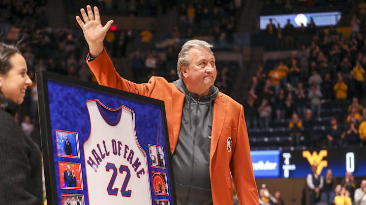 Dec 18, 2022; Morgantown, West Virginia, USA; West Virginia Mountaineers head coach Bob Huggins is honored before the game against the Buffalo Bulls on becoming a Class of 2022 inductee of the Naismith Memorial Basketball Hall of Fame at WVU Coliseum. Mandatory Credit: Ben Queen-Imagn Images Dec 18, 2022; Morgantown, West Virginia, USA; West Virginia Mountaineers head coach Bob Huggins is honored before the game against the Buffalo Bulls on becoming a Class of 2022 inductee of the Naismith Memorial Basketball Hall of Fame at WVU Coliseum. Mandatory Credit: Ben Queen-Imagn Images