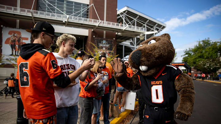 Benny the beaver high fives fans before the annual rivalry game against Oregon on Saturday, Sept. 14, 2024 at Reser Stadium in Corvallis, Ore.