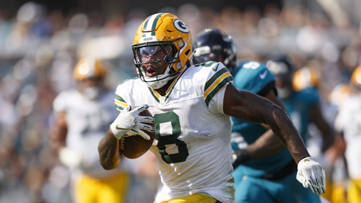 Green Bay Packers running back Josh Jacobs (8) runs the ball in for a touchdown against the Jacksonville Jaguars.