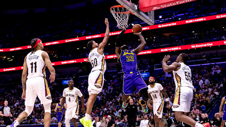 Nov 16, 2024; New Orleans, Louisiana, USA; Los Angeles Lakers forward LeBron James (23) drives to the basket against New Orleans Pelicans forward Jeremiah Robinson-Earl (50) and center Trey Jemison III (55) during the first half at Smoothie King Center. Nov 16, 2024; New Orleans, Louisiana, USA; Los Angeles Lakers forward LeBron James (23) drives to the basket against New Orleans Pelicans forward Jeremiah Robinson-Earl (50) and center Trey Jemison III (55) during the first half at Smoothie King Center.