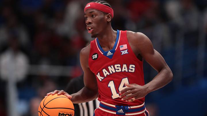 Kansas Jayhawks guard Melvin Council Jr. (14) dribbles up court against Kansas State Wildcats during the Sunflower Showdown game inside Allen Fieldhouse in Lawrence, Kansas, on Saturday, March 7, 2026.