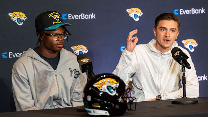 The Jacksonville Jaguars’ first-round pick, Colorado Buffaloes wide receiver and defensive back Travis Hunter, left, listens as General Manager James Gladstone, right. Answers questions during a press conference Friday, March 25, 2025 at Miller Electric Center in Jacksonville, Fla. [Doug Engle/Florida Times-Union]