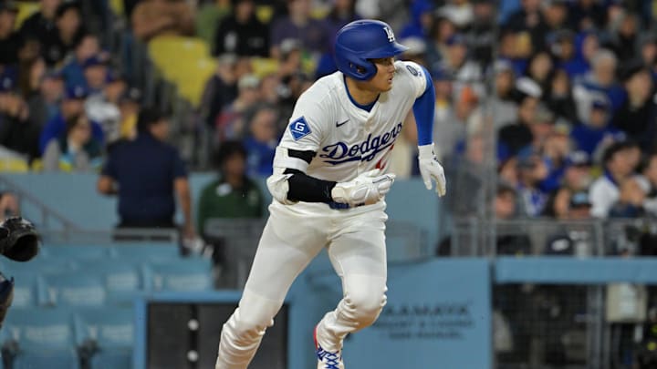 Apr 1, 2025; Los Angeles, California, USA;  Los Angeles Dodgers designated hitter Shohei Ohtani (17) singles in the sixth inning against the Atlanta Braves at Dodger Stadium. Mandatory Credit: Jayne Kamin-Oncea-Imagn Images