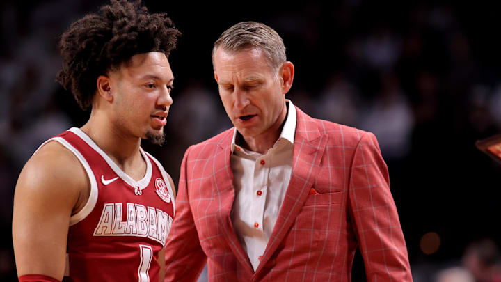 Jan 11, 2025; College Station, Texas, USA; Alabama Crimson Tide head coach Nate Oates talks with Alabama Crimson Tide guard Mark Sears (1) prior to the game against the Texas A&M Aggies at Reed Arena. Mandatory Credit: Erik Williams-Imagn Images