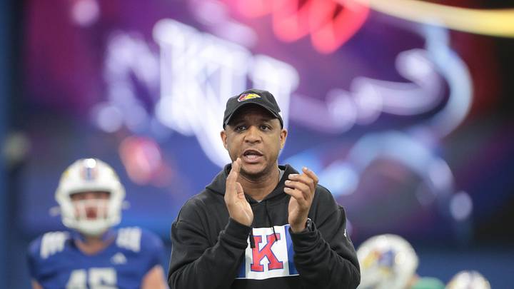 Kansas co-defensive coordinator and cornerbacks coach D.K. McDonald works with players during a team practice Tuesday, April 2, 2024, inside the Indoor Football Practice Facility.