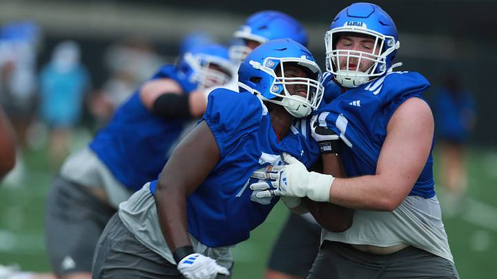Kansas sophomore offensive lineman
DeAndre Harper (72) works with redshirt sophomore defensive tackle Grady Seyfert (is 71) during practice at the outdoor practice fields in Lawrence on July 24, 2025. Kansas sophomore offensive lineman
DeAndre Harper (72) works with redshirt sophomore defensive tackle Grady Seyfert (is 71) during practice at the outdoor practice fields in Lawrence on July 24, 2025.