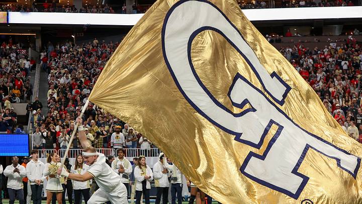 Nov 28, 2025; Atlanta, Georgia, USA; Georgia Tech Yellow Jackets cheerleader runs a flag on the field before a game against the Georgia Bulldogs at Mercedes-Benz Stadium. Mandatory Credit: Brett Davis-Imagn Images Nov 28, 2025; Atlanta, Georgia, USA; Georgia Tech Yellow Jackets cheerleader runs a flag on the field before a game against the Georgia Bulldogs at Mercedes-Benz Stadium. Mandatory Credit: Brett Davis-Imagn Images