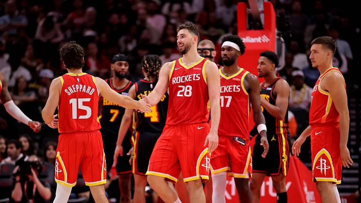 Oct 26, 2026; Houston, Texas, USA;  Houston Rockets center Alperen Sengun (28) is congratulated by teammates after a made basket against the Atlanta Hawks during the fourth quarter at Toyota Center.  Mandatory Credit: Erik Williams-Imagn Images