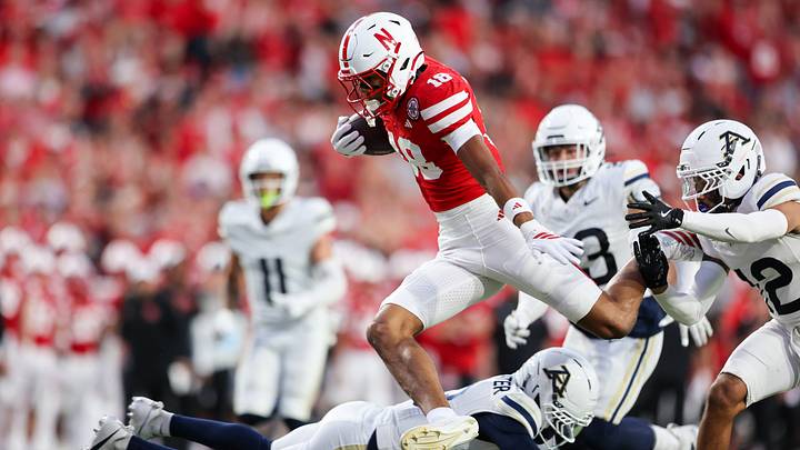 Nebraska wide receiver Quinn Clark avoids Akron defenders on the way to a 37-yard touchdown. Nebraska wide receiver Quinn Clark avoids Akron defenders on the way to a 37-yard touchdown.