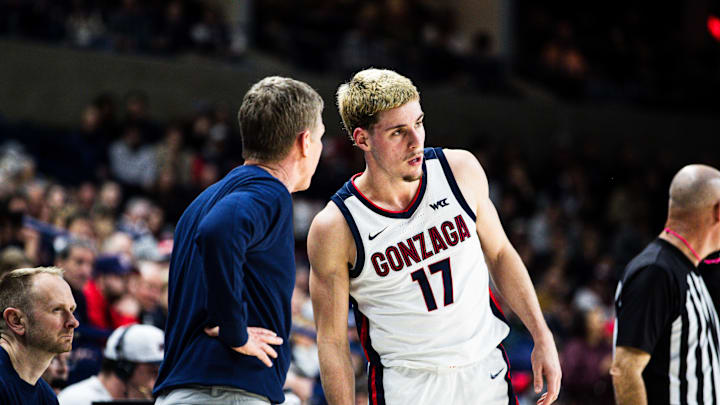 Gonzaga Bulldogs head coach Mark Few and guard Mario Saint-Supery (17). Gonzaga Bulldogs head coach Mark Few and guard Mario Saint-Supery (17).