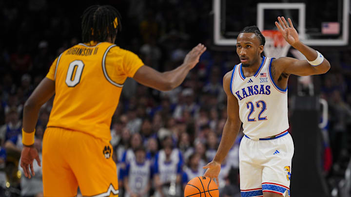 Dec 7, 2025; Kansas City, Missouri, USA; Kansas Jayhawks guard Darryn Peterson (22) dribbles the ball against Missouri Tigers guard Anthony Robinson II (0) during the first half at T-Mobile Center. Mandatory Credit: Jay Biggerstaff-Imagn Images Dec 7, 2025; Kansas City, Missouri, USA; Kansas Jayhawks guard Darryn Peterson (22) dribbles the ball against Missouri Tigers guard Anthony Robinson II (0) during the first half at T-Mobile Center. Mandatory Credit: Jay Biggerstaff-Imagn Images