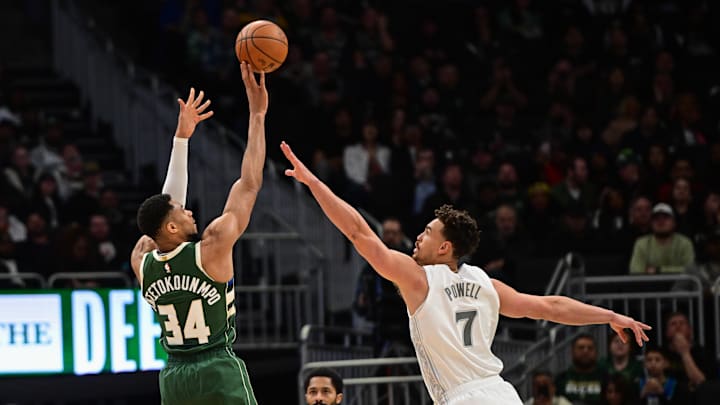 Mar 5, 2025; Milwaukee, Wisconsin, USA; Milwaukee Bucks forward Giannis Antetokounmpo (34) takes a shot against Dallas Mavericks center Dwight Powell (7) in the third quarter at Fiserv Forum. Mandatory Credit: Benny Sieu-Imagn Images Mar 5, 2025; Milwaukee, Wisconsin, USA; Milwaukee Bucks forward Giannis Antetokounmpo (34) takes a shot against Dallas Mavericks center Dwight Powell (7) in the third quarter at Fiserv Forum. Mandatory Credit: Benny Sieu-Imagn Images