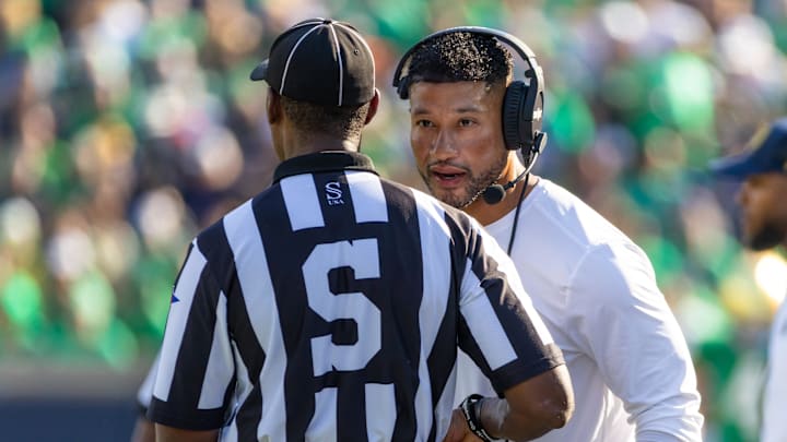 Oct 4, 2025; South Bend, Indiana, USA; Notre Dame Fighting Irish head coach Marcus Freeman talks to an official during the first half at Notre Dame Stadium. 