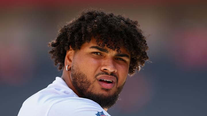 Tampa Bay Buccaneers offensive tackle Tristan Wirfs warms up before a game against the Denver Broncos.