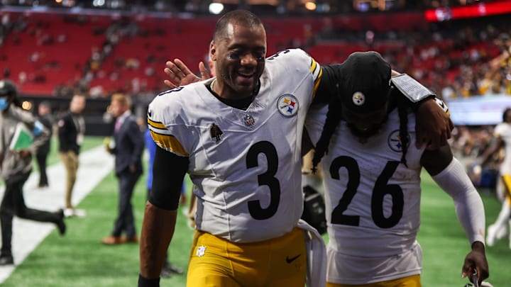 Sep 8, 2024; Atlanta, Georgia, USA; Pittsburgh Steelers quarterback Russell Wilson (3) and cornerback Donte Jackson (26) celebrate after a victory over the Atlanta Falcons at Mercedes-Benz Stadium. Mandatory Credit: Brett Davis-Imagn Images