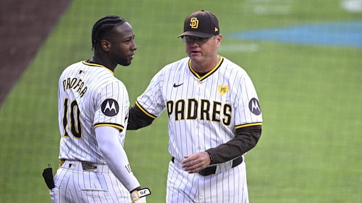 Jun 25, 2024; San Diego, California, USA; San Diego Padres left fielder Jurickson Profar (10) is held back by manager Mike Shildt (8) after a benches-clearing altercation against the Washington Nationals during the first inning at Petco Park. Mandatory Credit: Orlando Ramirez-Imagn Images