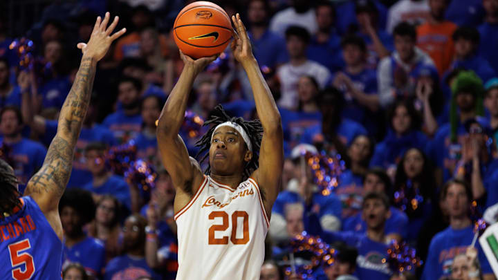 Jan 18, 2025; Gainesville, Florida, USA; Texas Longhorns guard Tre Johnson (20) shoots over Florida Gators guard Will Richard (5) during the first half at Exactech Arena at the Stephen C. O'Connell Center. Mandatory Credit: Matt Pendleton-Imagn Images