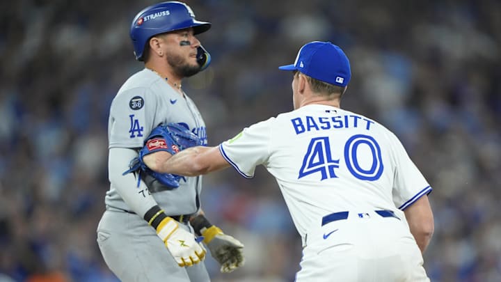 Nov 1, 2025; Toronto, Ontario, CAN; Toronto Blue Jays pitcher Chris Bassitt (40) tags out Los Angeles Dodgers second baseman Miguel Rojas (72) in the sixth inning during game seven of the 2025 MLB World Series at Rogers Centre. Mandatory Credit: John E. Sokolowski-Imagn Images Nov 1, 2025; Toronto, Ontario, CAN; Toronto Blue Jays pitcher Chris Bassitt (40) tags out Los Angeles Dodgers second baseman Miguel Rojas (72) in the sixth inning during game seven of the 2025 MLB World Series at Rogers Centre. Mandatory Credit: John E. Sokolowski-Imagn Images