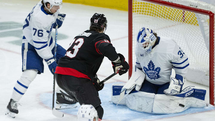 Apr 15, 2026; Ottawa, Ontario, CAN; Toronto Maple Leafs goalie Dennis Hildeby (35) makes a save on a shot from Ottawa Senators left wing Kurtis MacDermid (23) in the third period at the Canadian Tire Centre. Mandatory Credit: Marc DesRosiers-IMAGN Images