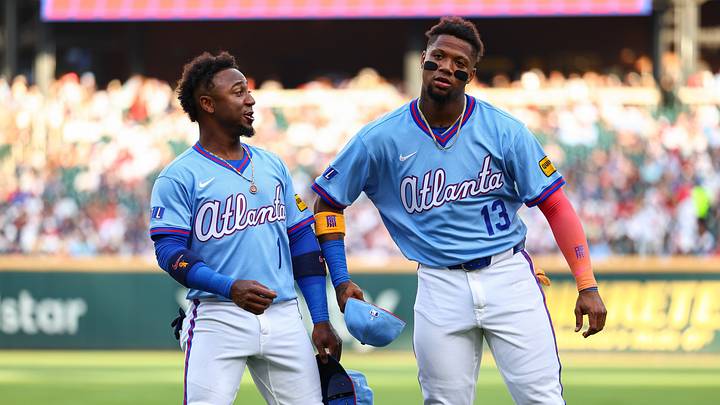 Aug 15, 2026; Cumberland, Georgia, USA; Atlanta Braves second baseman Ozzie Albies (1) and right fielder Ronald Acuña Jr. (13) react before a game against the Arizona Diamondbacks at Truist Park. Mandatory Credit: Colin Hubbard-Imagn Images