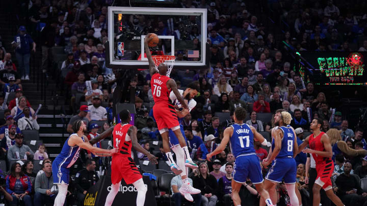 Apr 14, 2024; Sacramento, California, USA; Portland Trail Blazers guard Taze Moore (76) dunks against the Sacramento Kings.