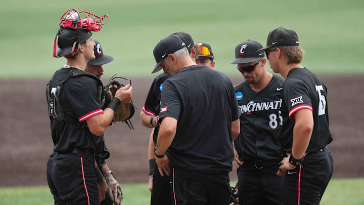 Cincinnati head baseball coach Jordan Bischel has a meeting at the pitchers mound during a NCAA regional baseball game between the Cincinnati Bearcats and Wake Forest Demon Deacons at Lindsey Nelson Stadium in Knoxville, Tenn., on June 1, 2025.